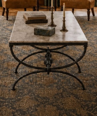 Marble top coffee table with a dark metal base